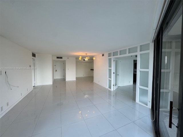 tiled spare room with built in shelves