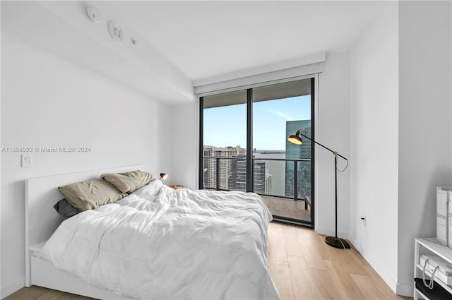 bedroom with light hardwood / wood-style floors