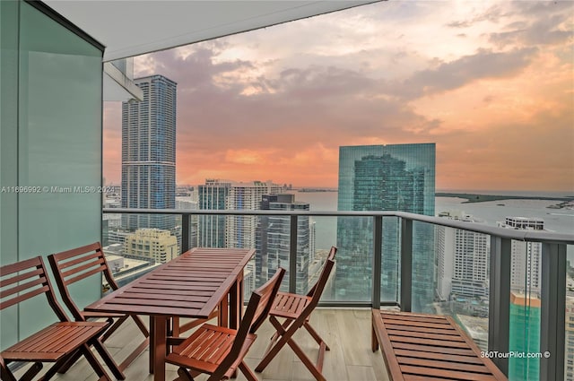 balcony at dusk with a water view