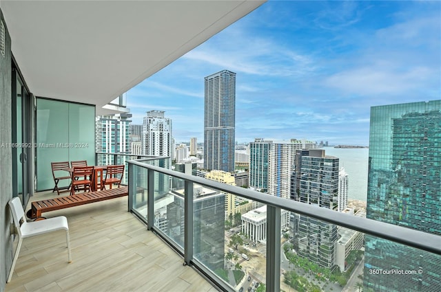 balcony featuring a water view