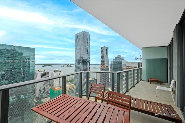 balcony featuring a water view