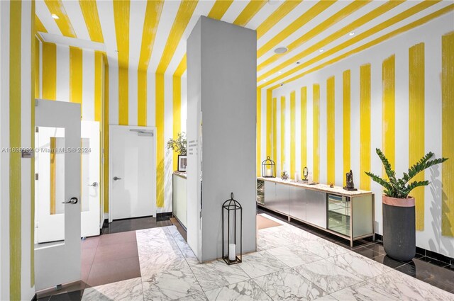1300 S Miami Ave Unit 3704, Miami, FL 33130 - foyer with wallpapered walls and beverage cooler