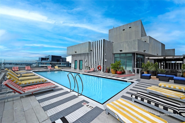 view of swimming pool with a patio