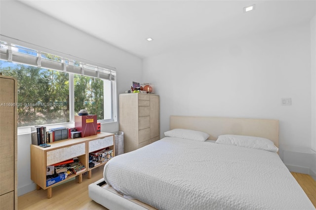 bedroom with wood-type flooring