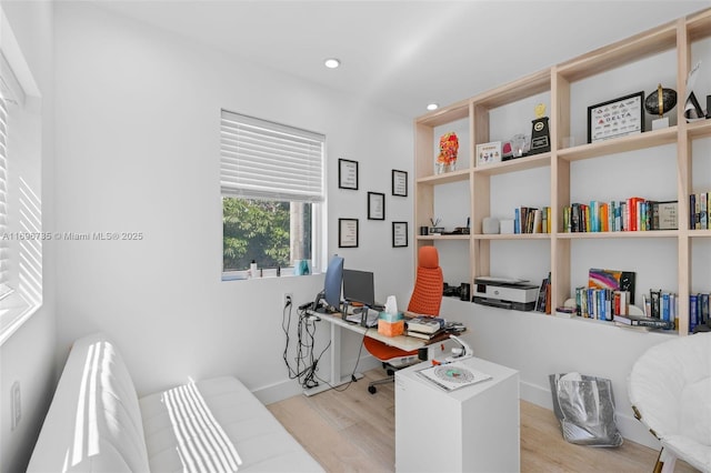 office space with light hardwood / wood-style floors