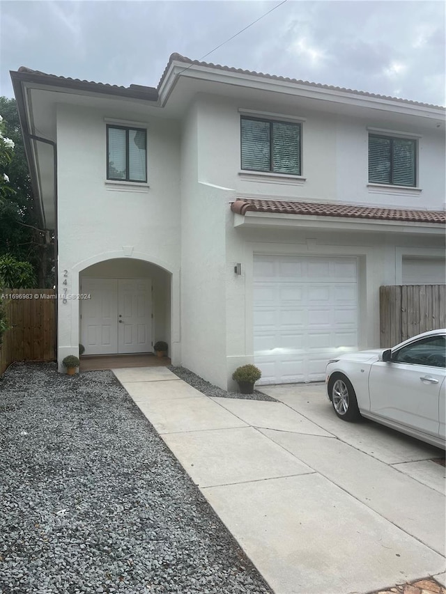 view of front of property with a garage