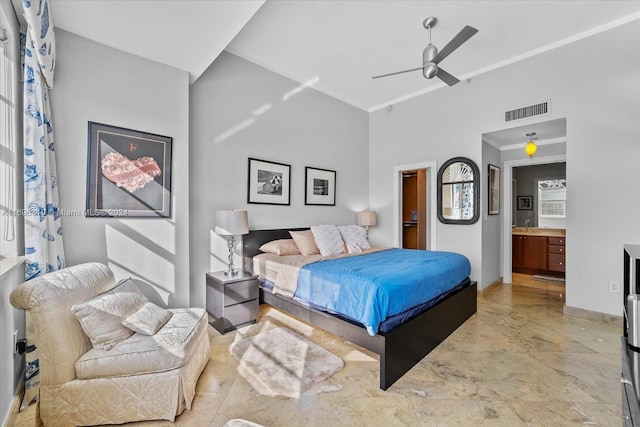 bedroom with ensuite bathroom, ceiling fan, and ornamental molding