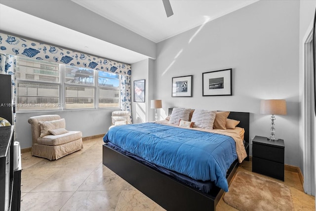 bedroom featuring ceiling fan and ornamental molding