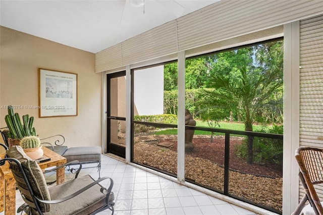 sunroom featuring ceiling fan