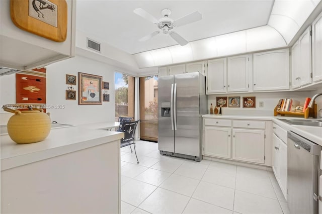 kitchen with stainless steel appliances, white cabinetry, ceiling fan, and sink