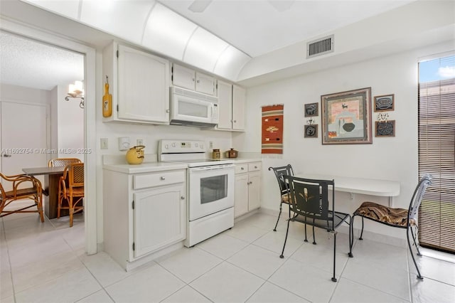 kitchen featuring white cabinets, white appliances, ceiling fan, and light tile patterned flooring