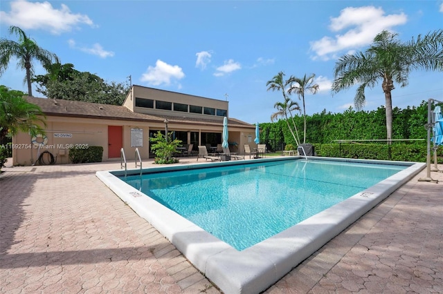 view of swimming pool with a patio