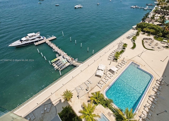 birds eye view of property with a water view