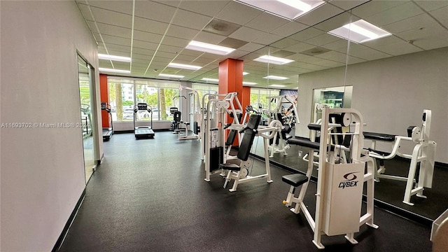 workout area with a paneled ceiling