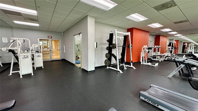 workout area with a drop ceiling