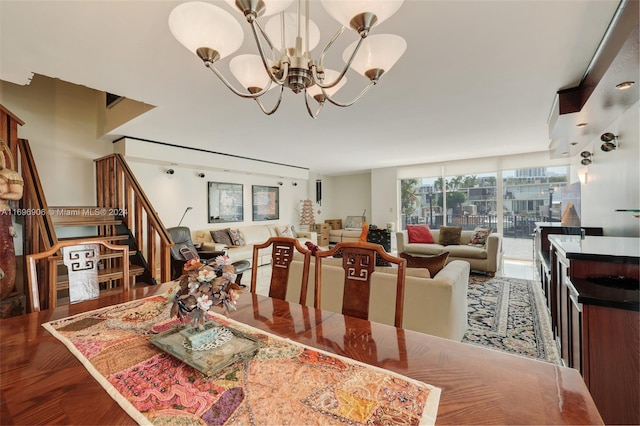 dining space with an inviting chandelier