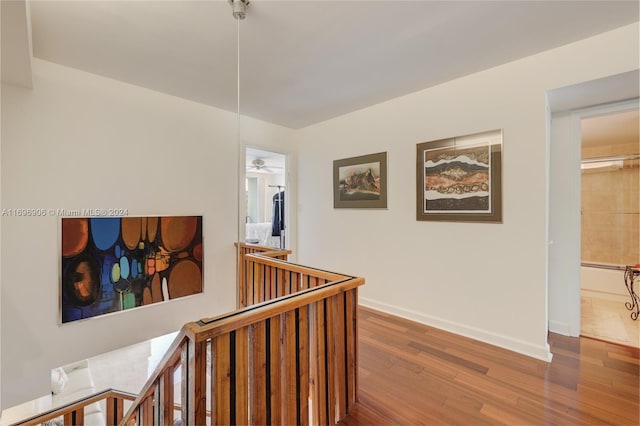 hallway with wood-type flooring