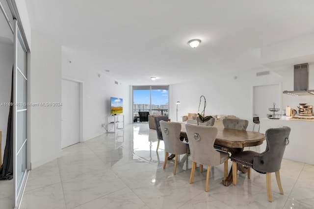 17301 Biscayne Blvd Unit 1404, North Miami, FL 33160 - dining space with expansive windows and light marble finish flooring