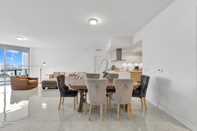 17301 Biscayne Blvd Unit 1404, North Miami, FL 33160 - dining area with expansive windows and light marble finish flooring