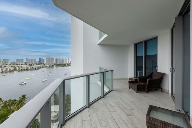 balcony featuring a water view