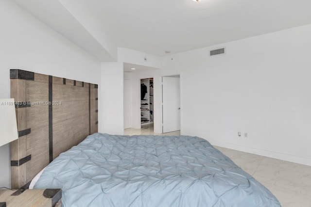 17301 Biscayne Blvd Unit 1404, North Miami, FL 33160 - bedroom with marble finish flooring and a walk in closet