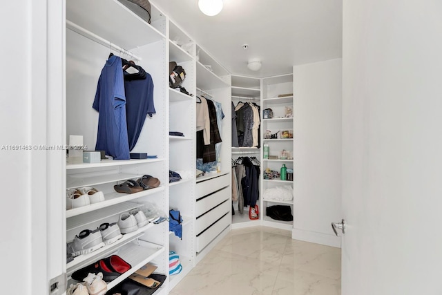 17301 Biscayne Blvd Unit 1404, North Miami, FL 33160 - walk in closet featuring marble tiled flooring