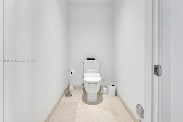 bathroom with tile patterned floors and toilet