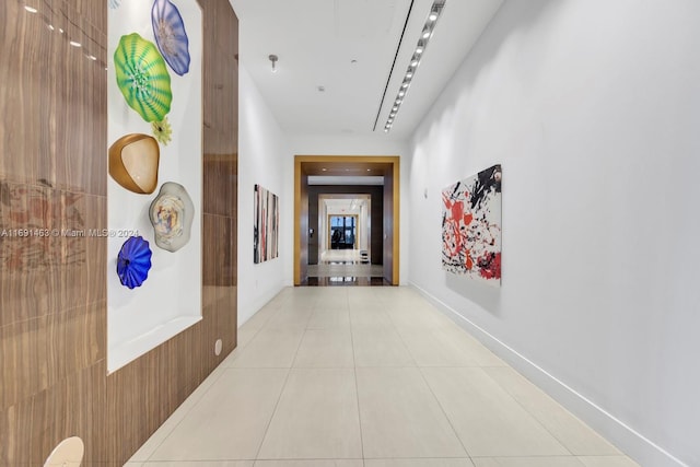 hallway featuring light tile patterned flooring