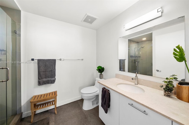 bathroom with vanity, toilet, and walk in shower