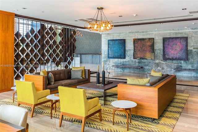 living room featuring light hardwood / wood-style flooring and an inviting chandelier