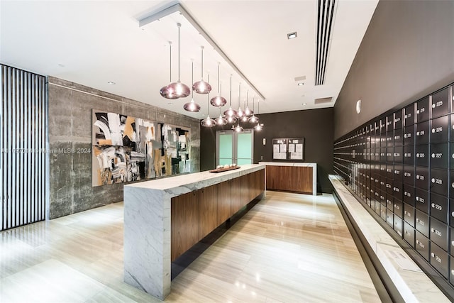 interior space with pendant lighting and mail boxes