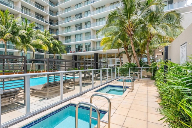 view of pool featuring a community hot tub