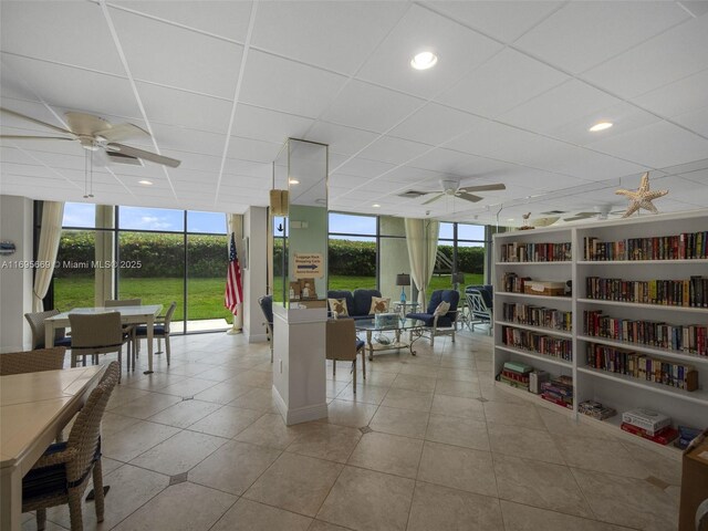 9940 S Ocean Dr Unit 508, Jensen Beach, FL 34957 - living area featuring ceiling fan, expansive windows, tile patterned flooring, a drop ceiling, and recessed lighting