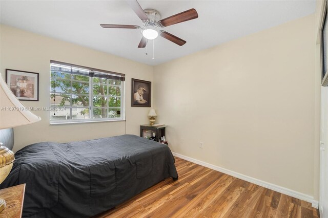 bedroom featuring wood-type flooring and ceiling fan