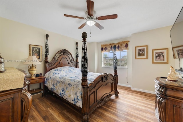 bedroom with hardwood / wood-style flooring and ceiling fan