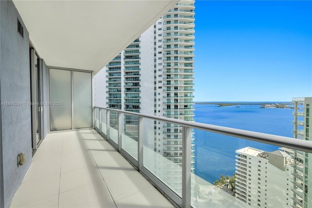 balcony featuring a water view