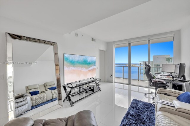 tiled living room with expansive windows