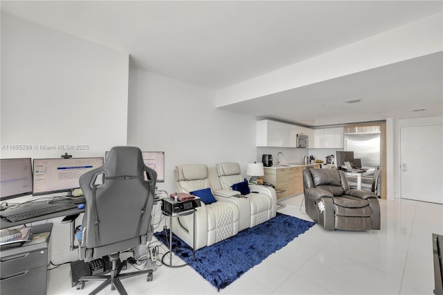 home office featuring sink and light tile patterned floors