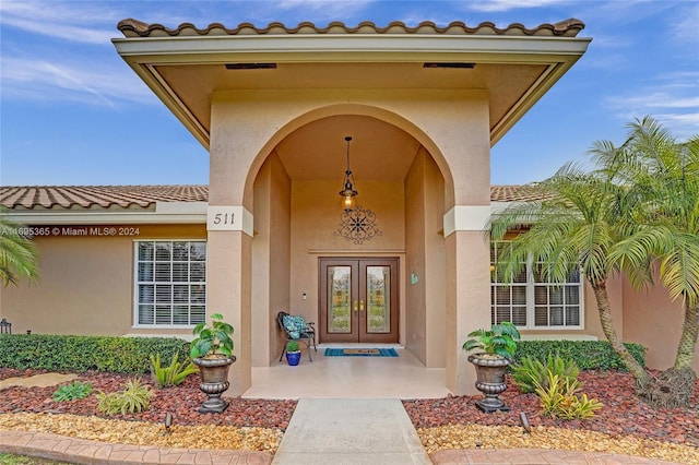 entrance to property featuring french doors