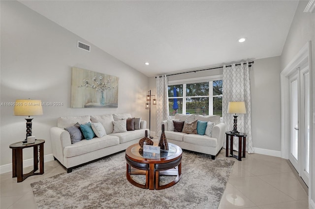 tiled living room with lofted ceiling