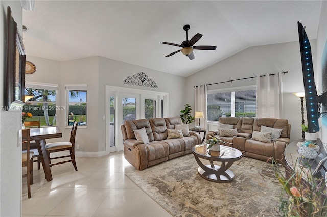 tiled living room featuring ceiling fan and lofted ceiling