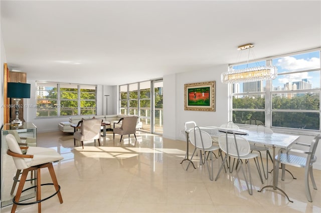 tiled dining area featuring expansive windows and a notable chandelier