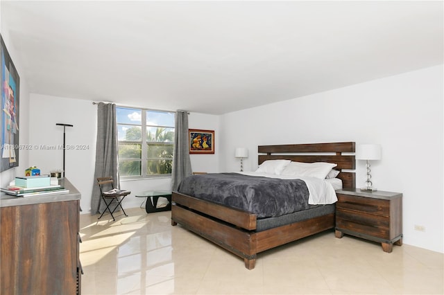 bedroom featuring light tile patterned flooring