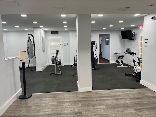 workout area featuring dark hardwood / wood-style floors