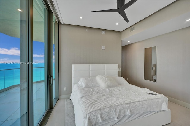 bedroom featuring access to outside, a water view, and ceiling fan