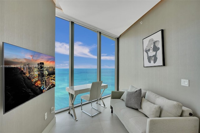 living room featuring floor to ceiling windows