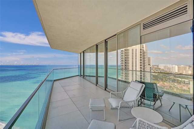 balcony featuring a water view