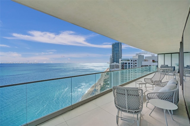 balcony featuring a water view