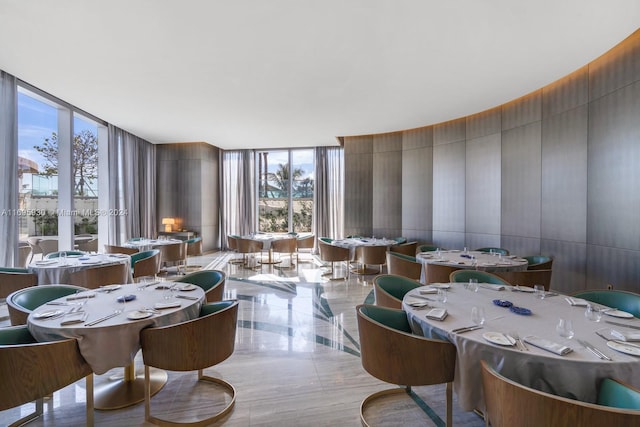 dining space with floor to ceiling windows