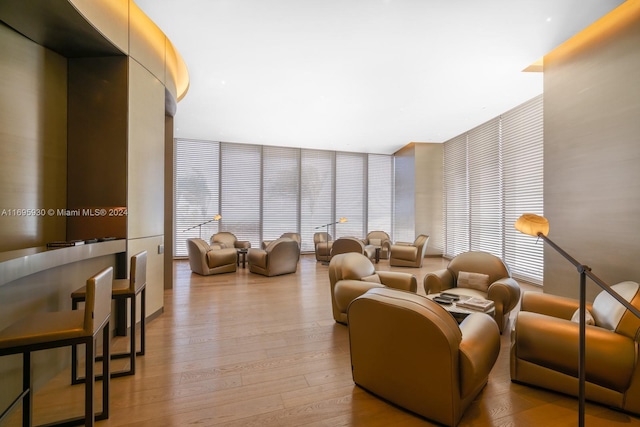 interior space featuring a wall of windows and light wood-type flooring